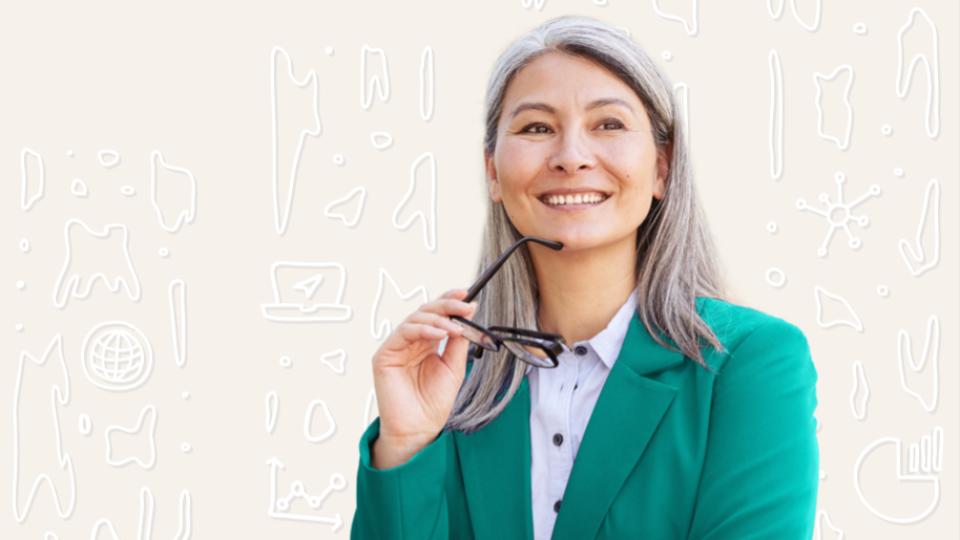 A smiling CFO holds her glasses, confident in the revenue forecast for her company