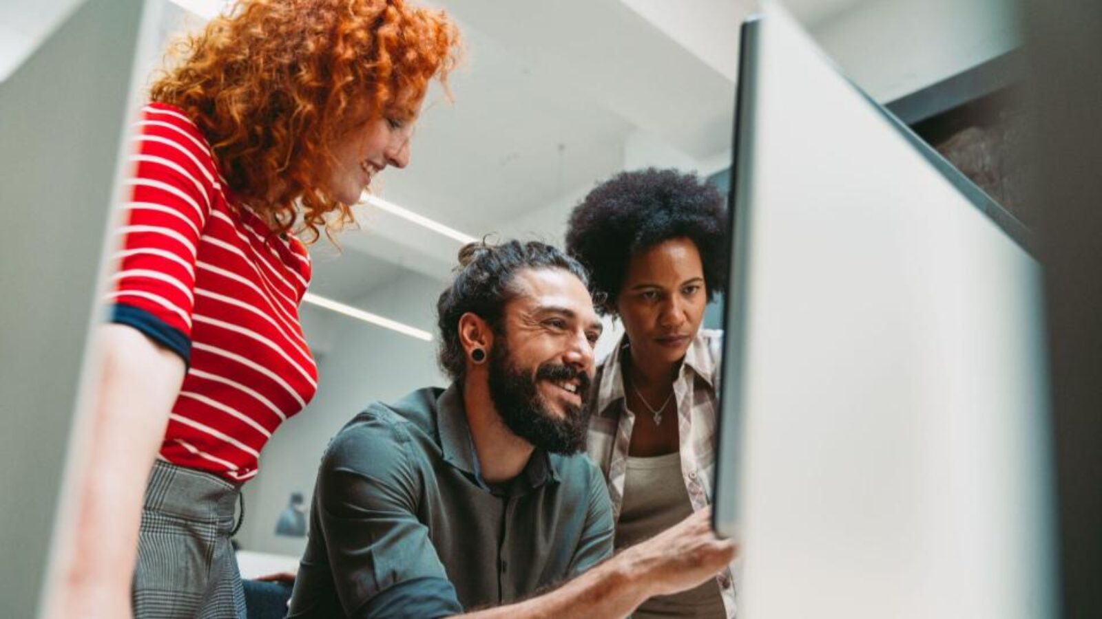 Marketing and sales team members look at intent data for a hot account.